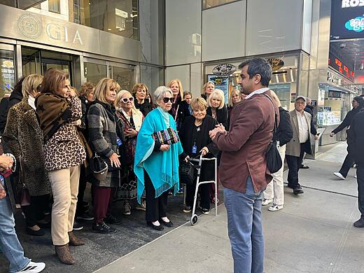 Hemant leads a group tour outside the GIA building
