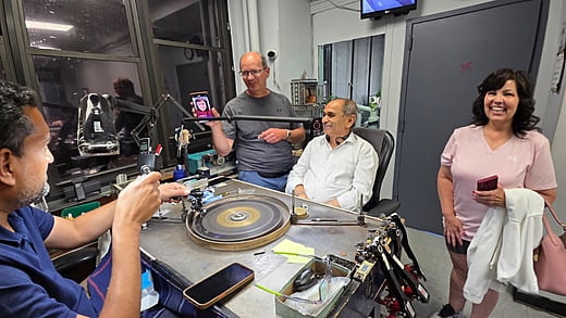 Guests watch a diamond being cut