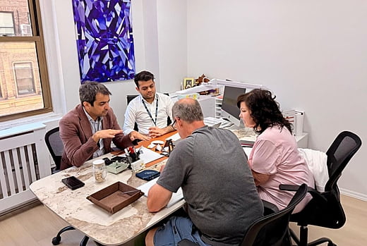 Guests learn about diamonds in a dealer's office